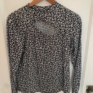 Suzy Shier mock neck top w/ asymmetrical cut out at neckline black & white print